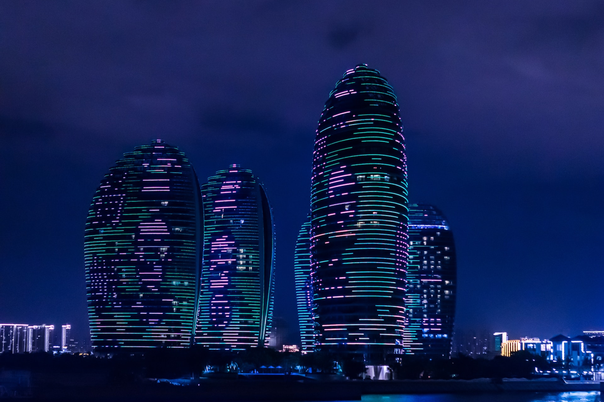 A futuristic city, with glowing skyscrapers