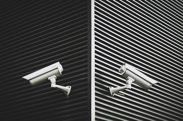 black and white walls with cctv security cameras