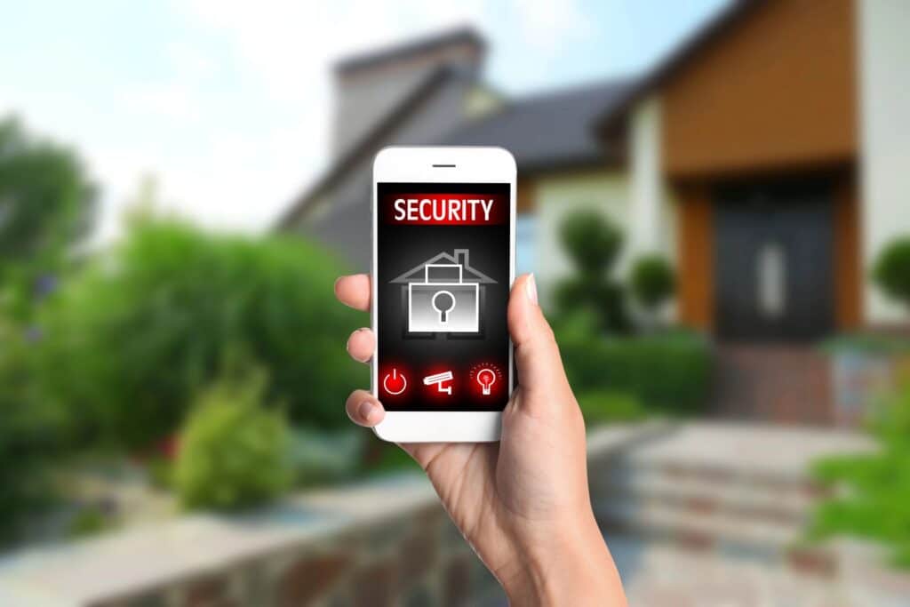 woman holding phone showing security alert